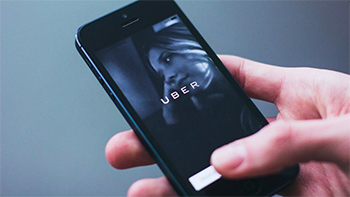 Person using Uber app on mobile phone